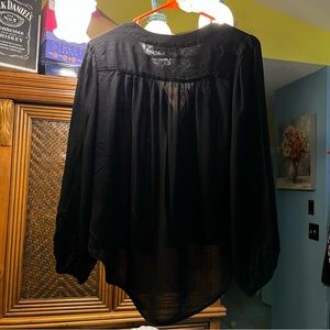 Black blouse size small worn once. It’s a little big on me.